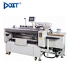 Máquina automática de coser ojales
